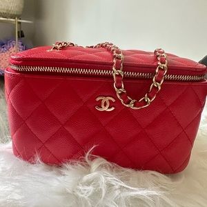 Real Chanel caviar quilted small vanity case with chain.
